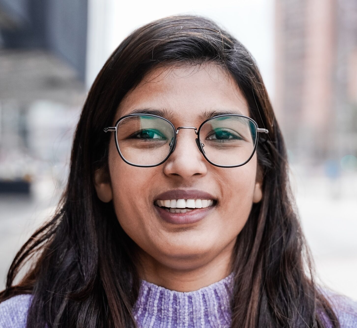 Happy Indian girl smiling on camera outdoor - Focus on face